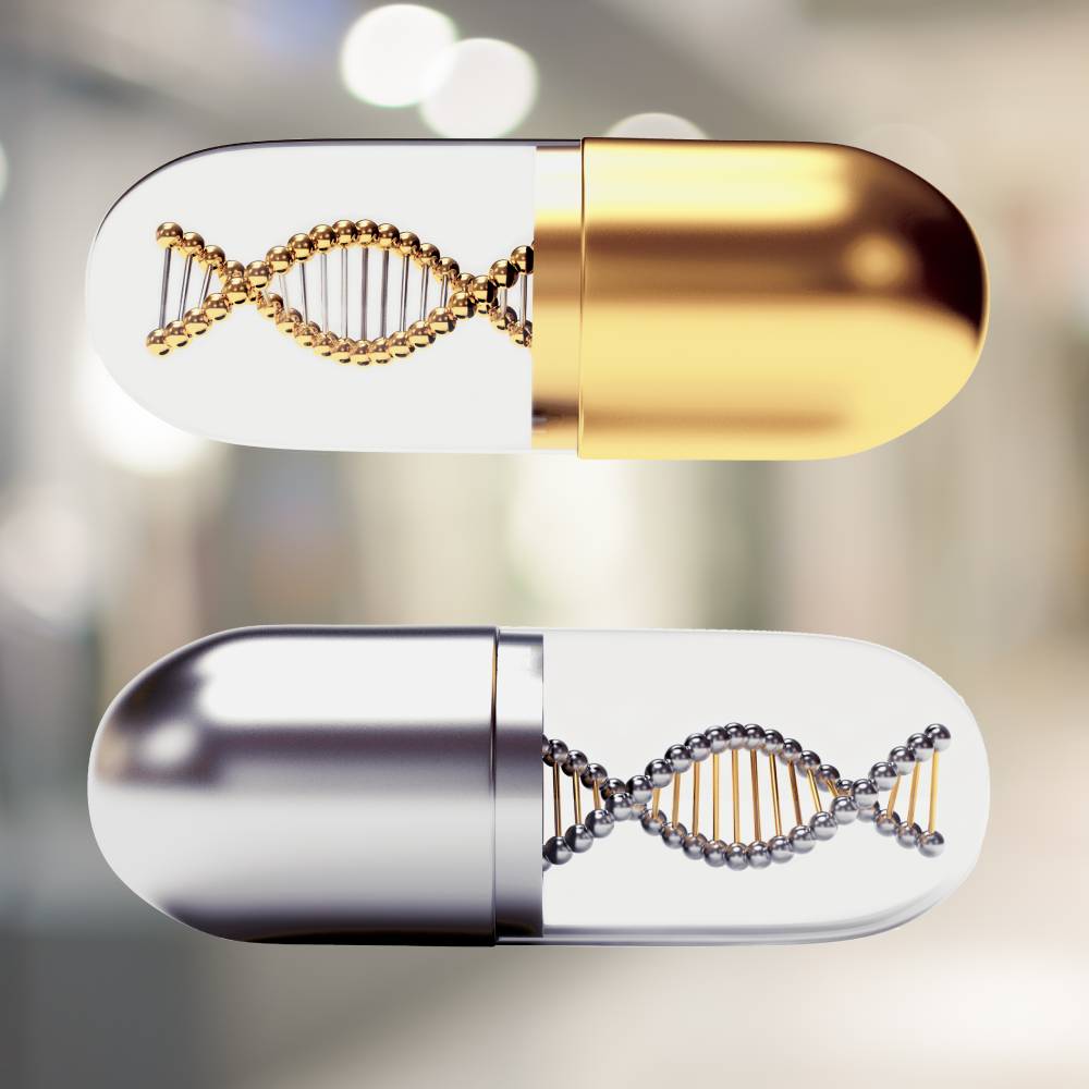 Golden and silver medical capsules with a DNA molecule structure inside